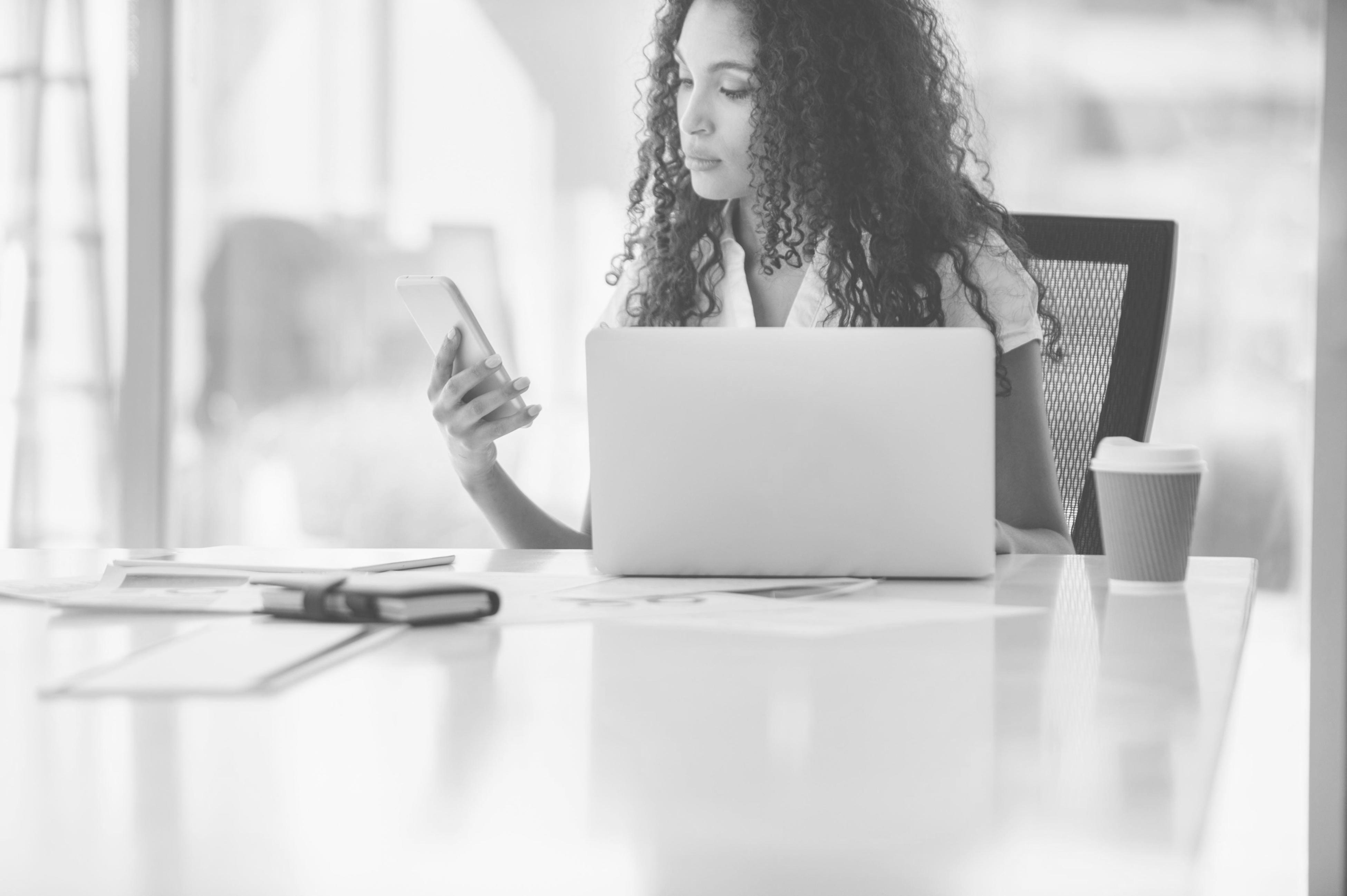 Financial planning workspace with laptop and budget planning materials
